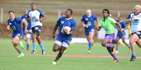 Wits rugby player Wandisile Simelane running to score a try.